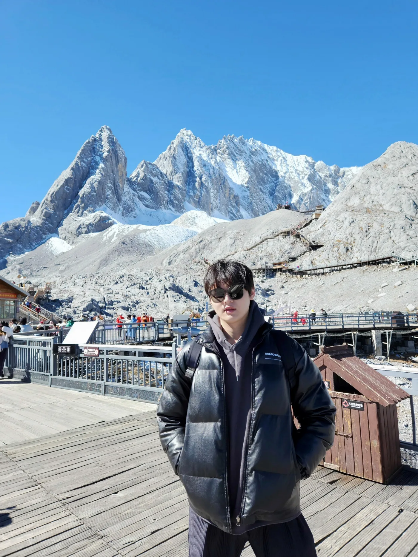 Linyun Jiang in front of a snow-capped mountain