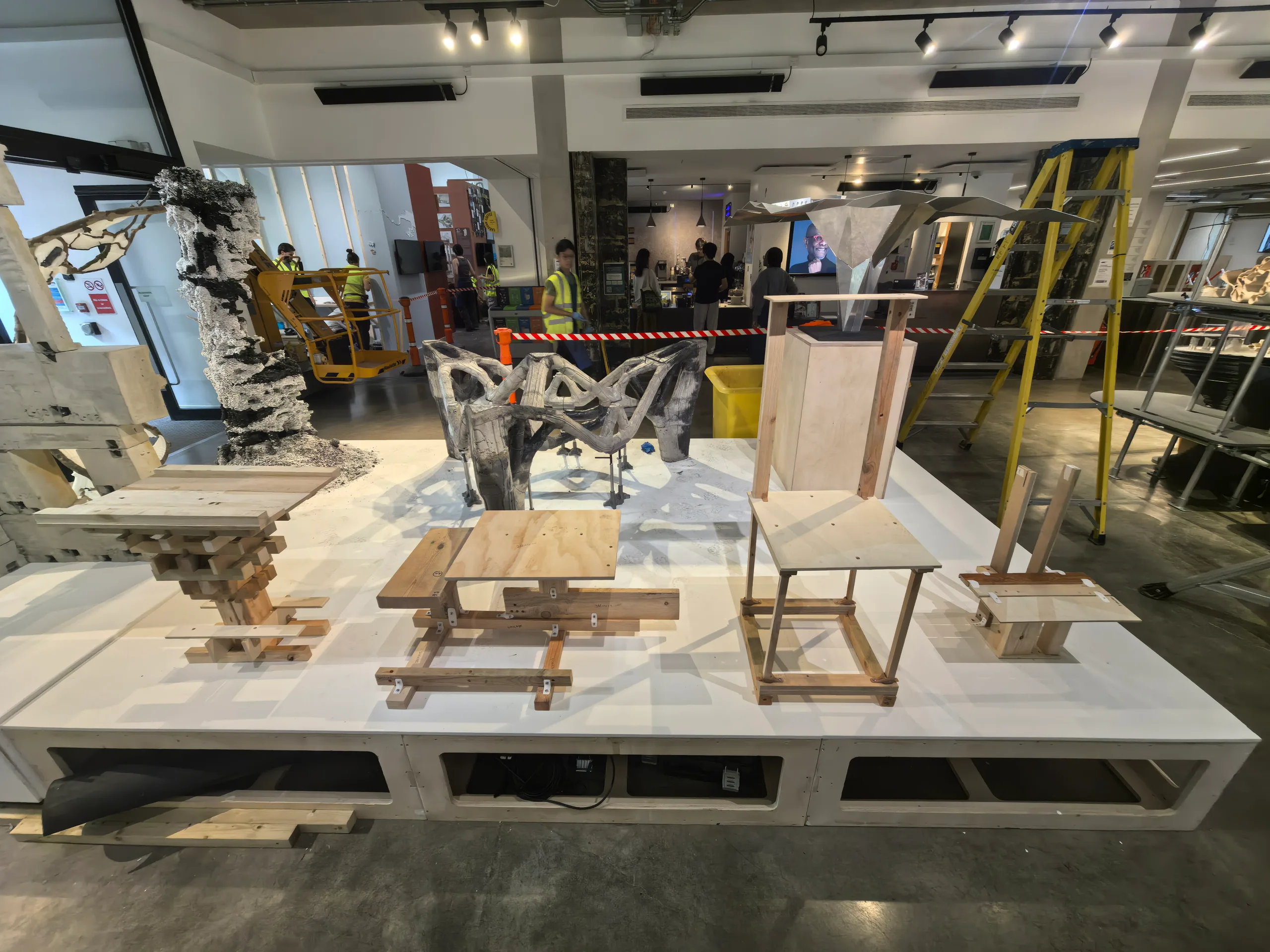 The Bartlett Autumn Show 2026: The timber pieces on their plinth during installation, the earlier rounds at the right and the later ones at the left